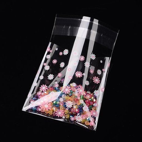 Cellofaan zakjes met plakstrip bloemetjes roze en wit 10 stuks